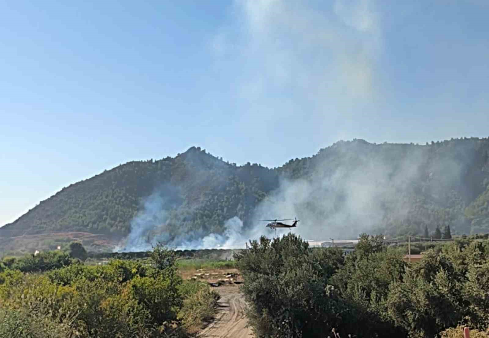 Muğla’nın Dalaman ilçesinde tarım arazisinde başlayan yangına havadan ve karadan